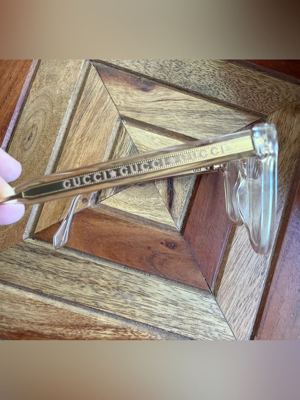 Gucci women’s Clear Frame Glasses with Gold Detailing